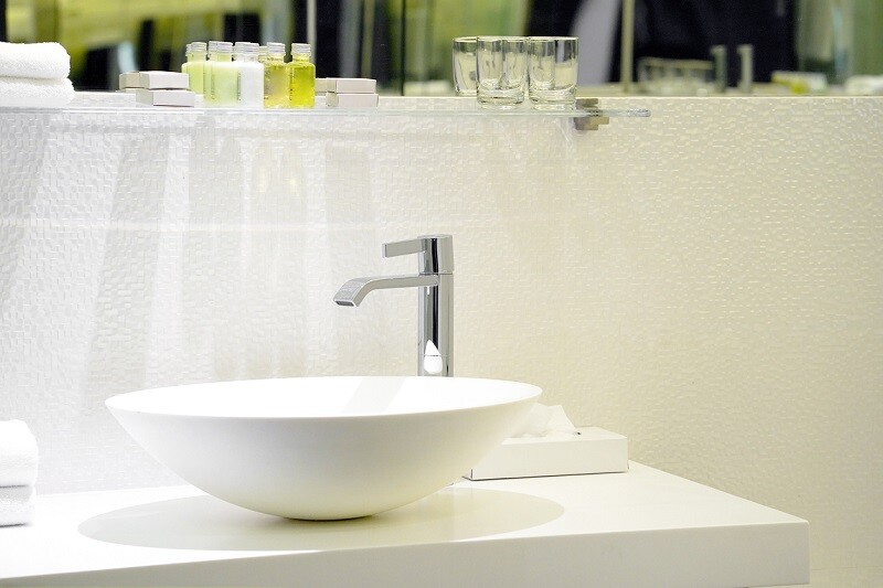 Modern white bathroom sink with faucet