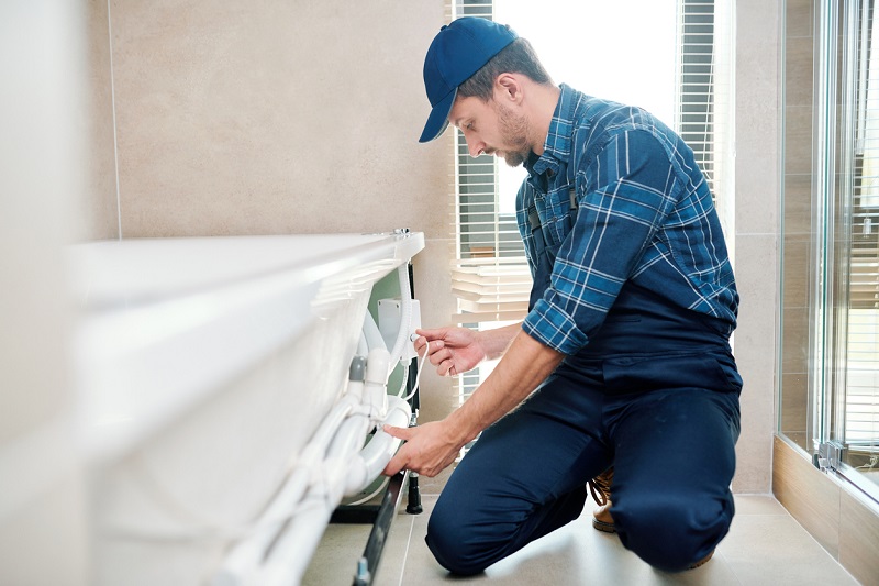 Man Fixing Bathtub