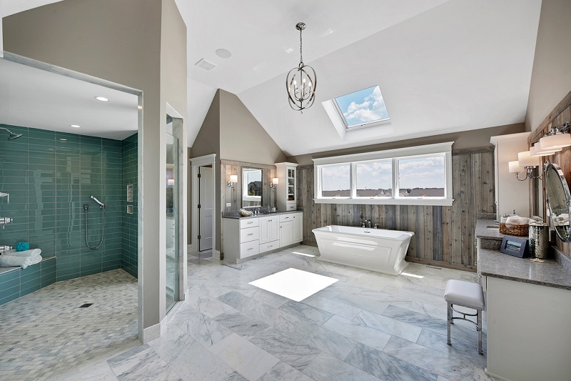 Spectacular walk-in shower in a spacious bathroom with skylights