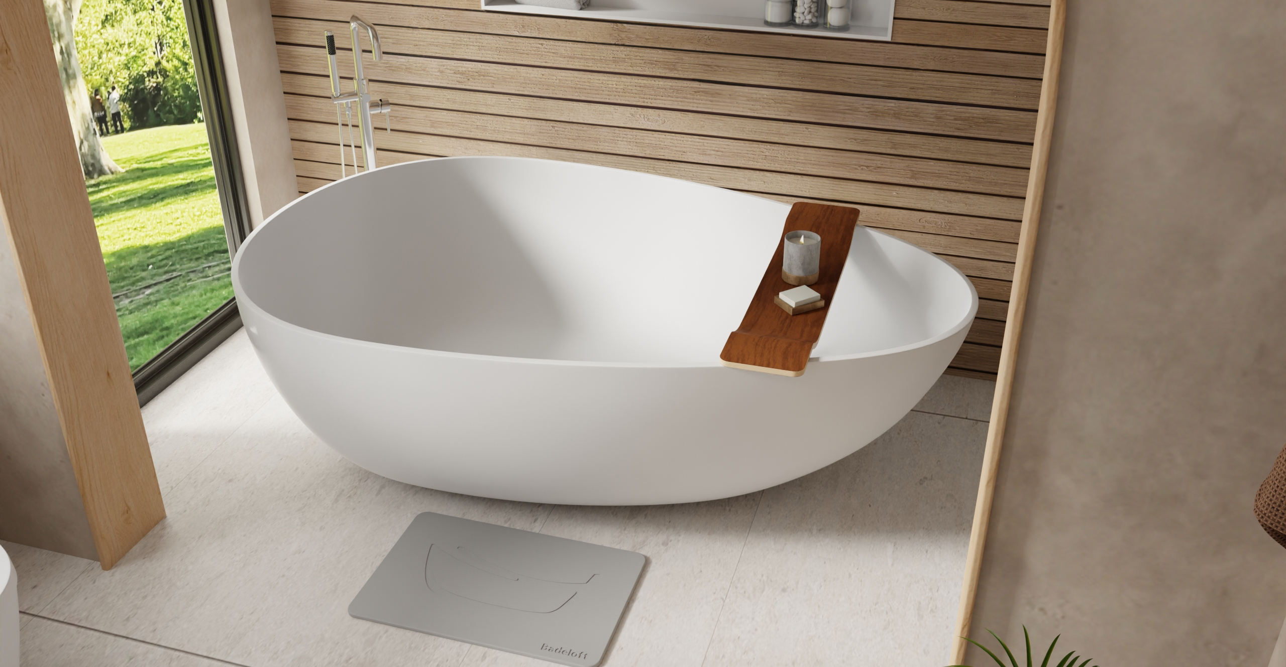 Badeloft BW-01-XXL white gloss freestanding bathtub in outdoor spa setting with wooden privacy wall, chrome ladder and garden view