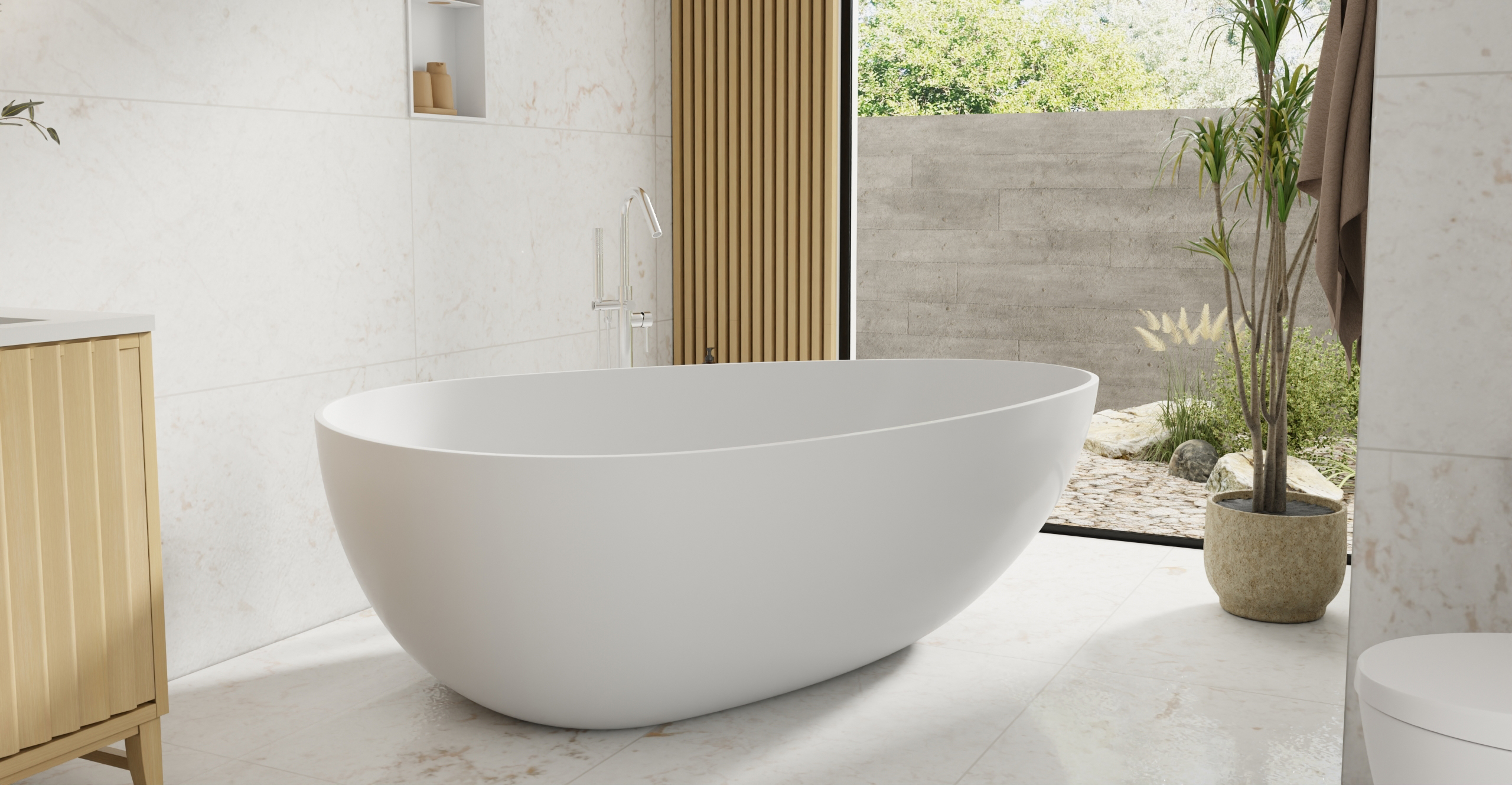 Badeloft BW-01-XXL white gloss freestanding bathtub side view in luxury bathroom with garden view, marble floors and tropical plants