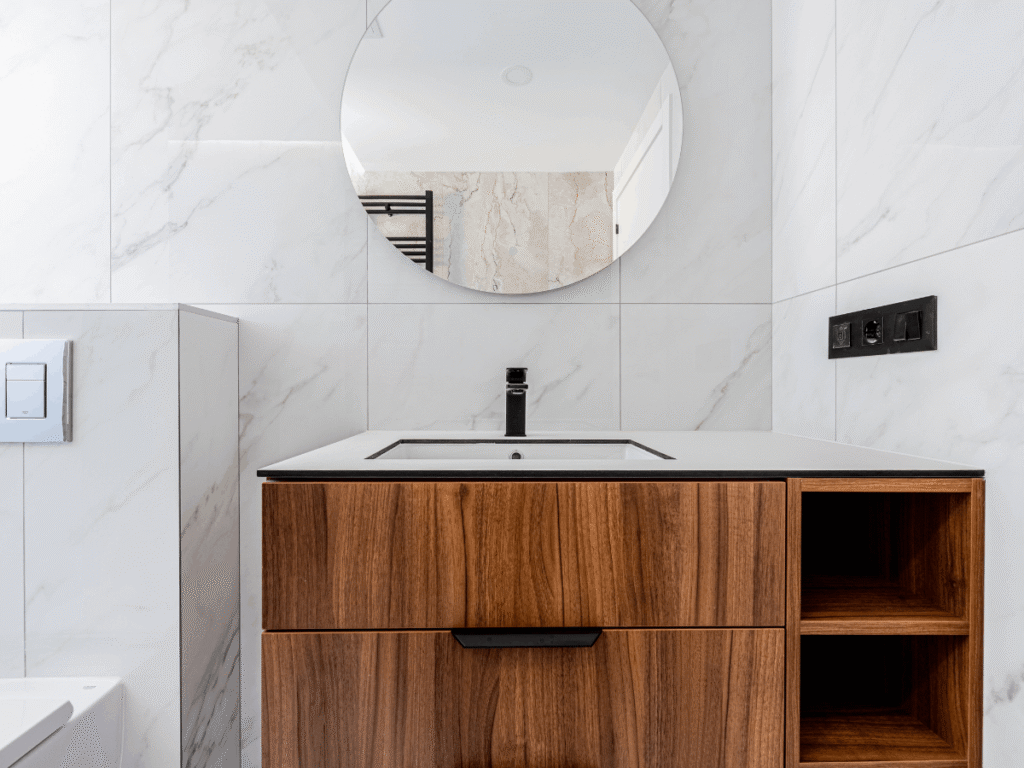 Modern Wood Bathroom Vanity with Marble Tile & Round Mirror